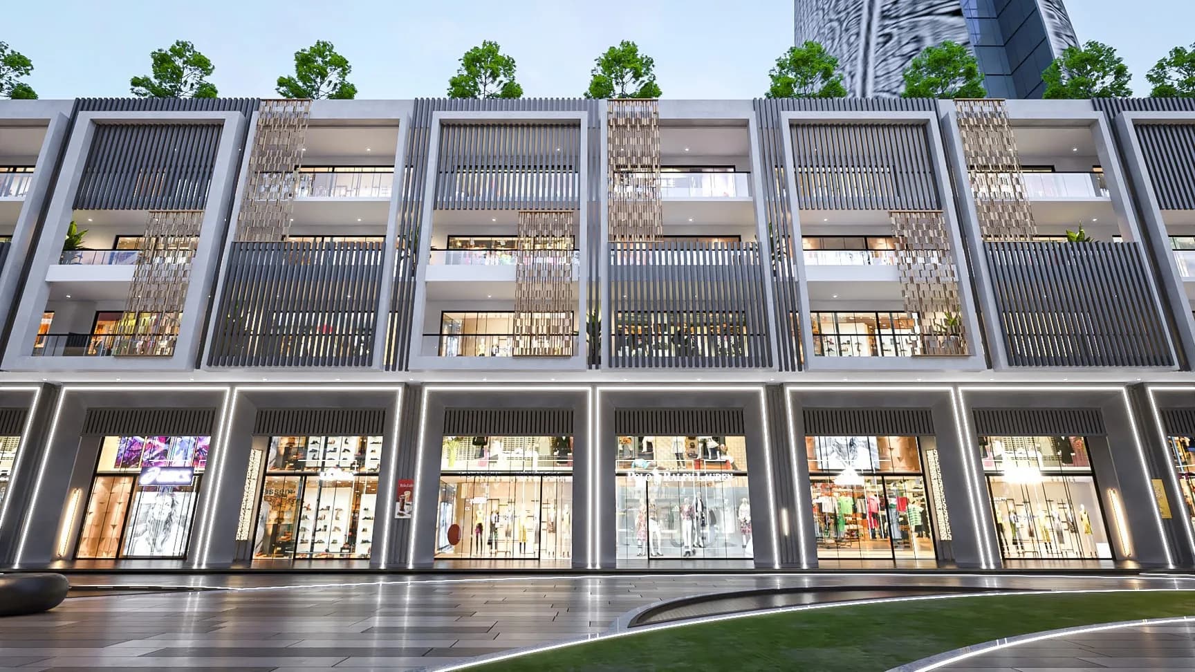 Render of the India World Mart shop-cum-office block at dusk: lit showroom fronts at ground level below three floors of glazed offices framed by grey fins and gold screens.