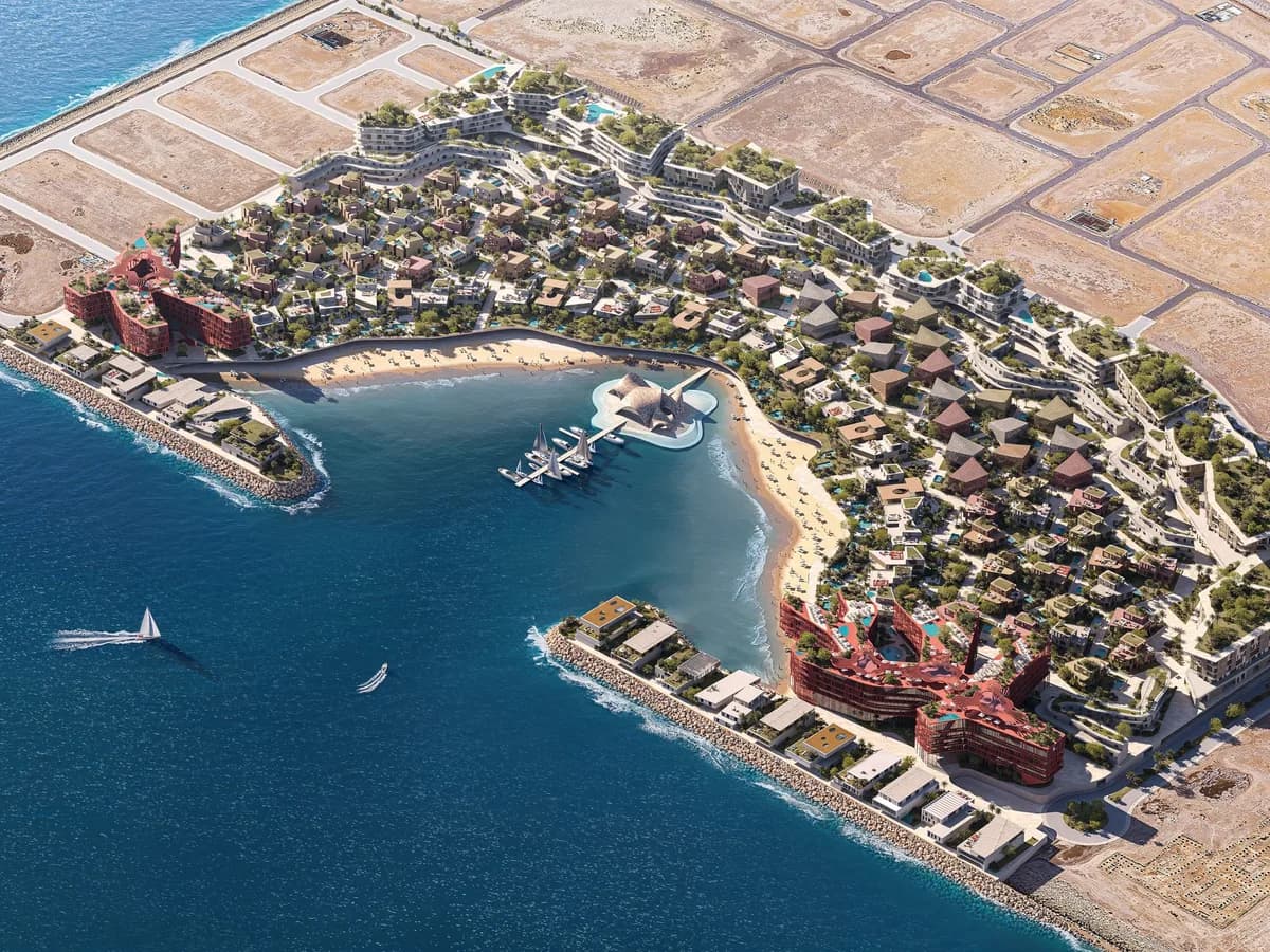 High aerial render of the Mira Coral Bay peninsula with its crescent beach, marina, breakwaters and surrounding plots