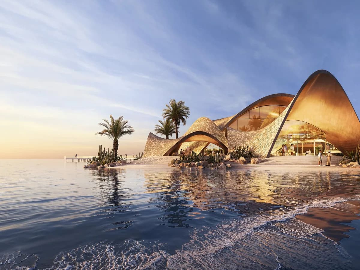 Render of the Mira Coral Bay yacht club, a shell-shaped bronze pavilion on the water at sunset with palms