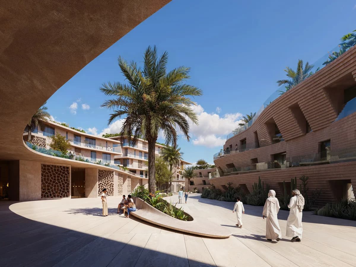 Render of a curved hotel courtyard with a palm, terraced sandstone buildings and people walking