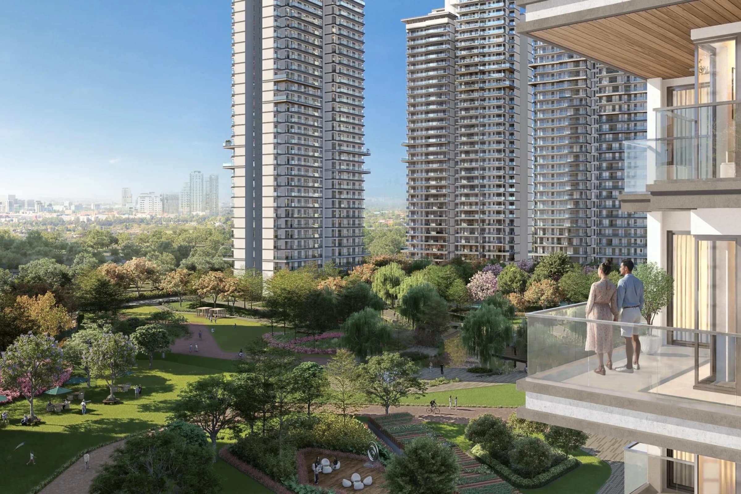 Artist's impression of Serenity Hills high-rise towers around landscaped central greens, seen from a balcony where a couple stands