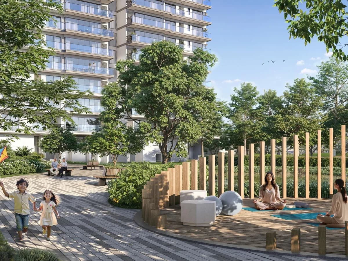 Artist's impression of a landscaped courtyard with a timber-screened yoga deck, children playing and a residential tower behind