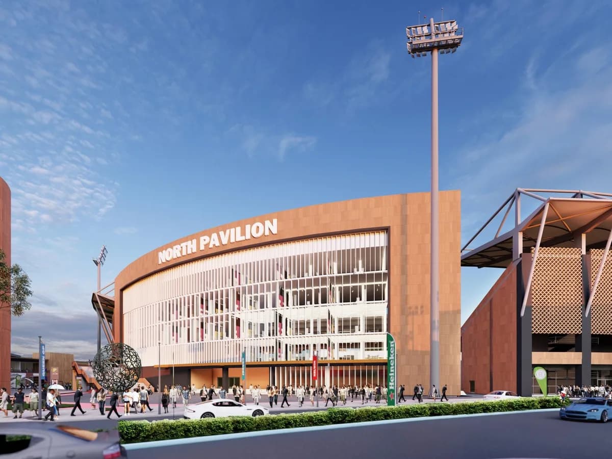 Render of the stadium's North Pavilion entrance with crowds walking in, a floodlight mast and the stadium stand to the right