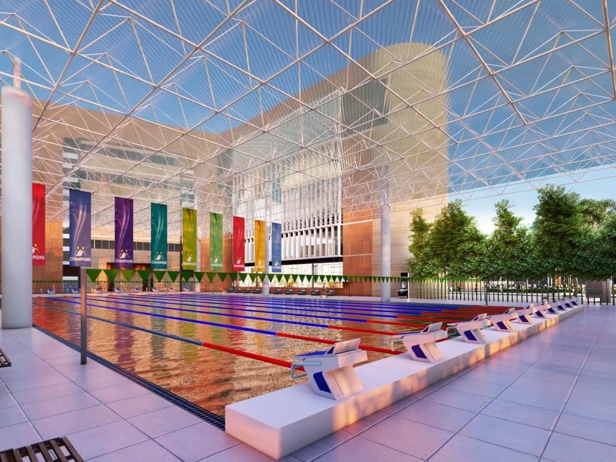 Render of a covered lap swimming pool with starting blocks, coloured banners and a space-frame roof