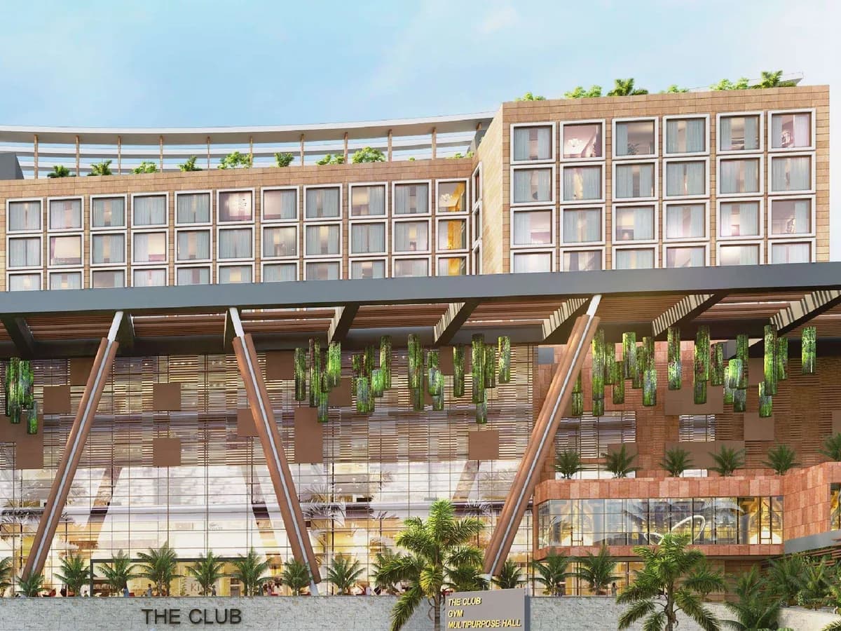 Render of The Club building with a sloping timber canopy, hanging planters and a hotel block above, signage 'The Club, Gym, Multipurpose Hall'